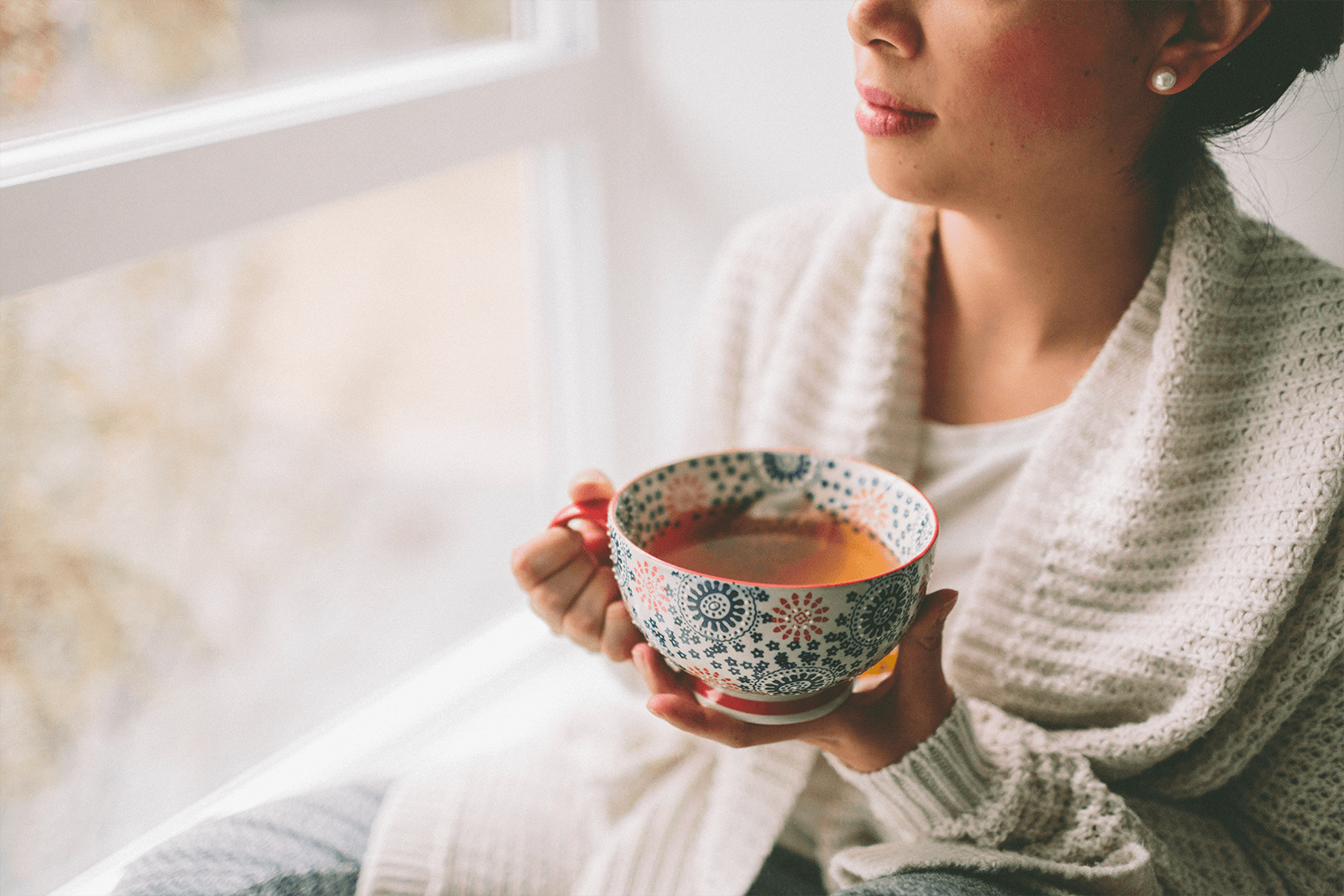 a woman drinking tea